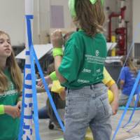 Students build a paper tower for Physics Olympics